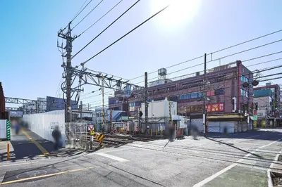 a view of a train yard with a building at MAT ARAIYAKUSHI West in Tokyo
