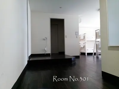 a room with white walls and a wooden floor at Ace Inn Asakusa in Tokyo