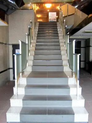 a stairway in a building with a bunch of stairs at Ace Inn Asakusa in Tokyo