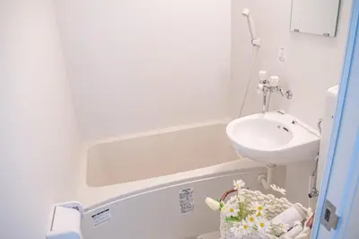 a small bathroom with a sink and a toilet at shinjuku 2 stops,3-4 people,train walk for 5mins in Tokyo