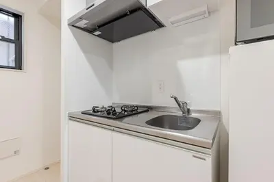a white kitchen with a sink and a stove at ksf\u4e0a\u6c60\u888b3\u4e01\u76ee102 in Tokyo