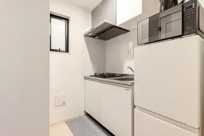 a white kitchen with a sink and a stove at ksf\u4e0a\u6c60\u888b3\u4e01\u76ee201 in Tokyo