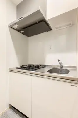 a white kitchen with a sink and a stove at ksf\u4e0a\u6c60\u888b3\u4e01\u76ee201 in Tokyo