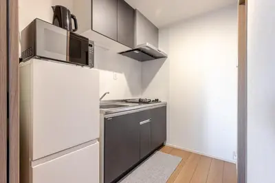 a small kitchen with a stove and a refrigerator at ksf\u4e0a\u6c60\u888b3\u4e01\u76ee202 in Tokyo