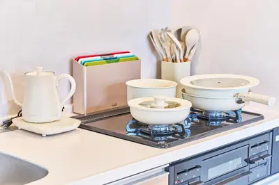 a kitchen counter with bowls and utensils on it at Nomadland Shinagawa Omori 1004 in Tokyo