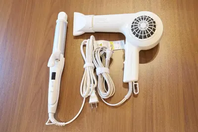 a white hair dryer sitting on top of a table at Nomadland Shinagawa Omori 1004 in Tokyo