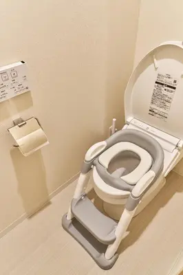 a bathroom with a toilet with a seat and a step stool at Nomadland Shinagawa Omori 1004 in Tokyo