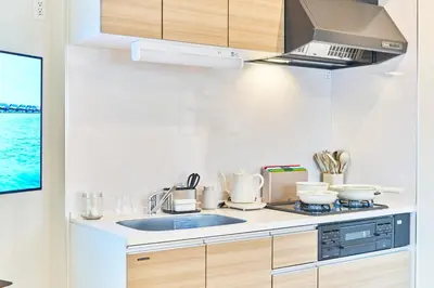 a kitchen with a sink and a stove at Nomadland Shinagawa Omori 1004 in Tokyo