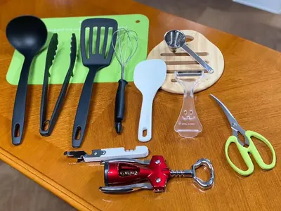 a group of utensils sitting on a wooden table at \u5b50\u732b\u306e\u5bb6 103t in Tokyo