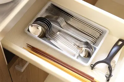 a tray of utensils in a drawer with a knife at Y's INN 池袋西 029T in Tokyo