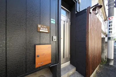 a door to a building with a sign on it at Y's INN 池袋西 029T in Tokyo