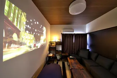 a living room with a couch and a table at Y's INN 池袋西 029T in Tokyo