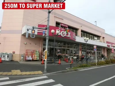 a street sign in front of a shopping center at Cozy Zoom-Easy access to UENO ASAKUSA AKIHABARA R3 in Tokyo