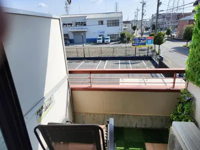 a balcony with a table and chairs on a building at Cozy Zoom-Easy access to UENO ASAKUSA AKIHABARA R3 in Tokyo