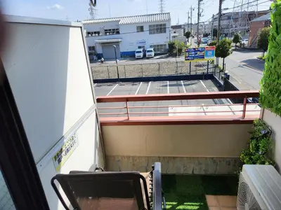 a balcony with a table and chairs on a building at Cozy Zoom-Easy access to UENO ASAKUSA AKIHABARA R3 in Tokyo