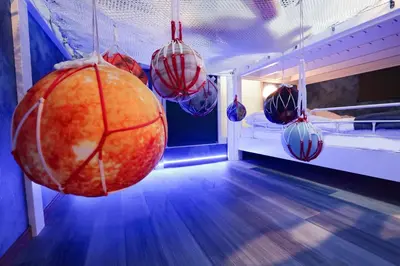 a room with balls hanging from the ceiling at Fantasy Lodge in Tokyo