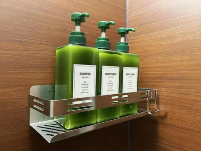 a rack with four green bottles on a wall at ERA 1927 Koenji in Tokyo