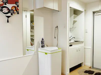a bathroom with white cabinets and a sink at Shin-Koenji loft apartment close to Tokyo Metro14mins to Shinjuku in Tokyo