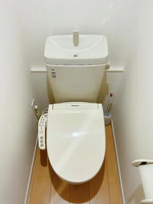 a white toilet in a bathroom with a remote control at Shin-Koenji loft apartment close to Tokyo Metro14mins to Shinjuku in Tokyo