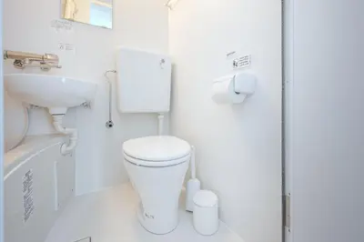 a small bathroom with a toilet and a sink at Hit\u9326\u7cf8\u753a in Tokyo