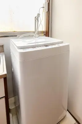 a white refrigerator in a kitchen with a sink at won\u58a8\u75305\u4e01\u76ee in Tokyo
