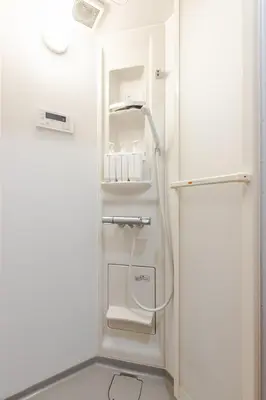 a white bathroom with a shower in a room at won\u58a8\u75305\u4e01\u76ee in Tokyo
