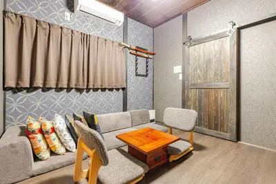 a living room with a couch and a table at won\u58a8\u75305\u4e01\u76ee in Tokyo