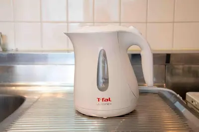 a tea kettle sitting on top of a kitchen counter at FIKA Asakusa in Tokyo
