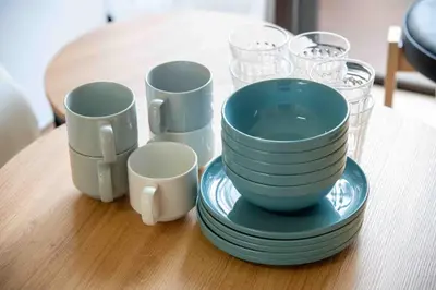 a group of cups and plates on a table at FIKA Asakusa in Tokyo