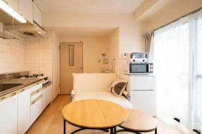 a small kitchen with a table and a small room at FIKA Asakusa in Tokyo