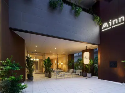 a restaurant with tables and chairs in a building at Minn Nihonbashi Suitengumae in Tokyo