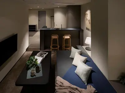 a living room with a blue bed and a kitchen at Minn Nihonbashi Suitengumae in Tokyo