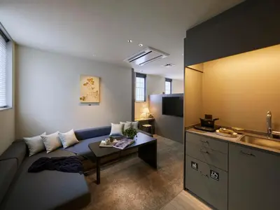 a living room with a couch and a table at Minn Nihonbashi Suitengumae in Tokyo