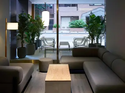 a living room with a couch and a coffee table at Minn Nihonbashi Suitengumae in Tokyo