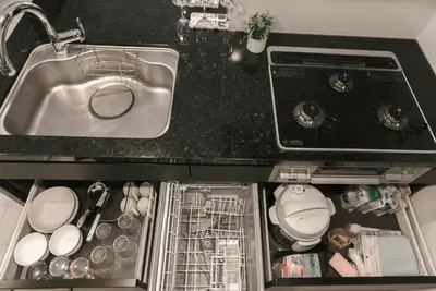 a kitchen counter with a sink and a sink at Roppongi Designer Apartment Newly built 5 minutes walk to the station in Tokyo
