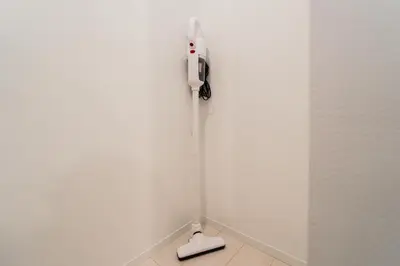 a white wall with a phone and a scale at Roppongi Designer Apartment Newly built 5 minutes walk to the station in Tokyo