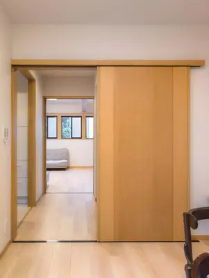 a sliding door in a room with a bed at Miyabi Inn-Higashi Koiwa in Tokyo