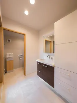 a large bathroom with a sink and a mirror at Miyabi Inn-Higashi Koiwa in Tokyo