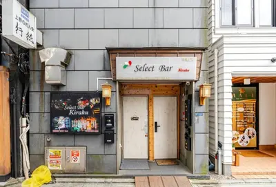 a storefront of a street shop with a sign over the door at \u4e0a\u91ce\u65e5\u5f0f\u6c11\u5bbf in Tokyo