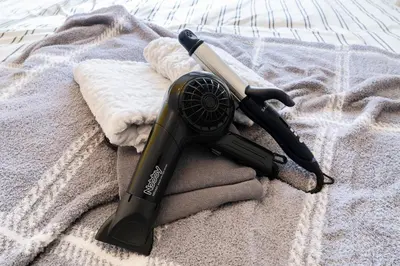 a hair dryer sitting on top of a towel at Felizstay Tokyo in Tokyo