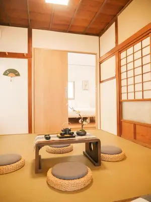 a room with a table and some chairs in it at 9Stay\u897f\u6d45\u8349 in Tokyo