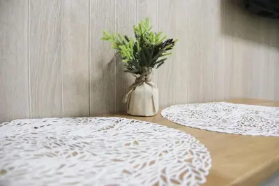 a vase with a plant in it sitting on a table at Sensoji 2ppl Apt in Tokyo