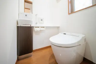 a white bathroom with a toilet and a sink at Kashikirikotate - Vacation STAY 18912 in Tokyo