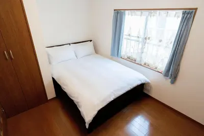 a small bed in a small room with a window at Kashikirikotate - Vacation STAY 18912 in Tokyo