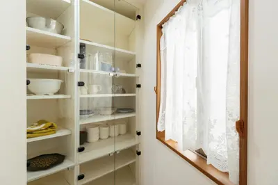a glass cabinet with a window in a kitchen at Kashikirikotate - Vacation STAY 18912 in Tokyo