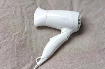 a white hair dryer sitting on top of a table at Marvelous Higashikanda - Vacation STAY 88199v in Tokyo