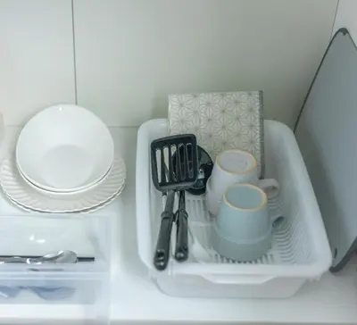a shelf with plates and utensils in a refrigerator at Marvelous Higashikanda - Vacation STAY 88263v in Tokyo
