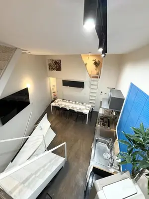 a room with a kitchen and a dining room at Hotel Alphinaud - Vacation STAY 91089v in Tokyo