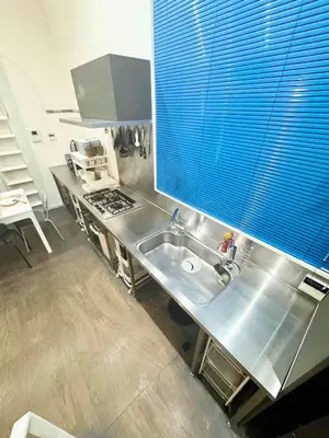 a kitchen with a stainless steel sink and a window at Hotel Alphinaud - Vacation STAY 91089v in Tokyo