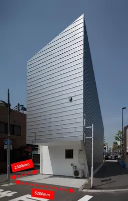 a large white building with a staircase on a street at Hotel Alphinaud - Vacation STAY 91089v in Tokyo